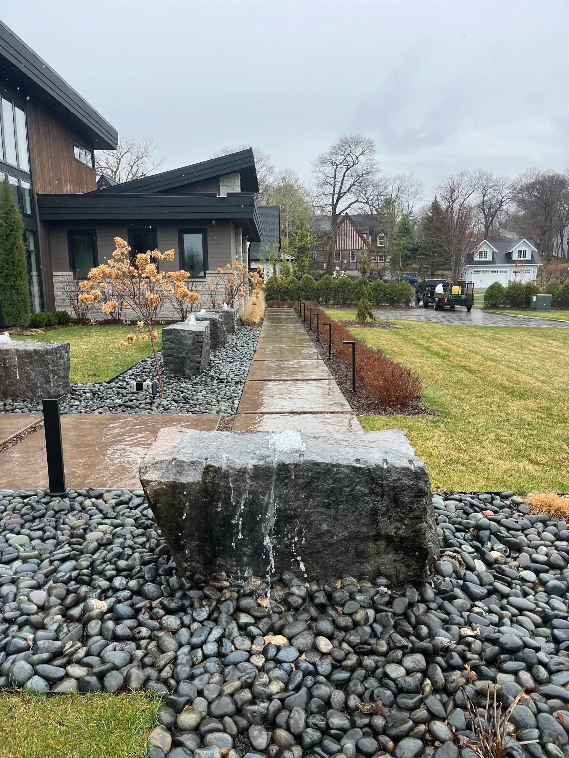 Hardscaping in Carver Minnesota featuring a block retaining wall and paver walkway